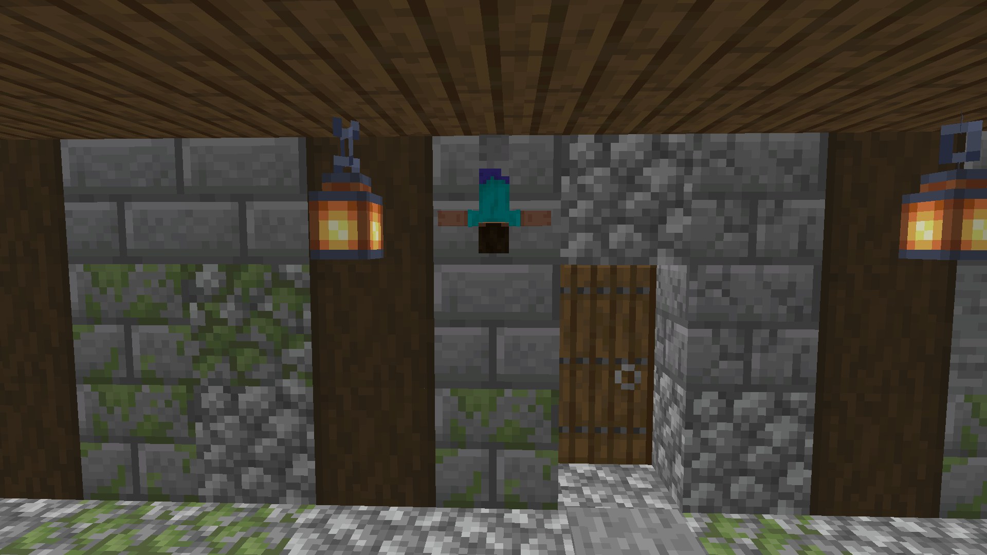 A camouflaged player clinging to a stone wall